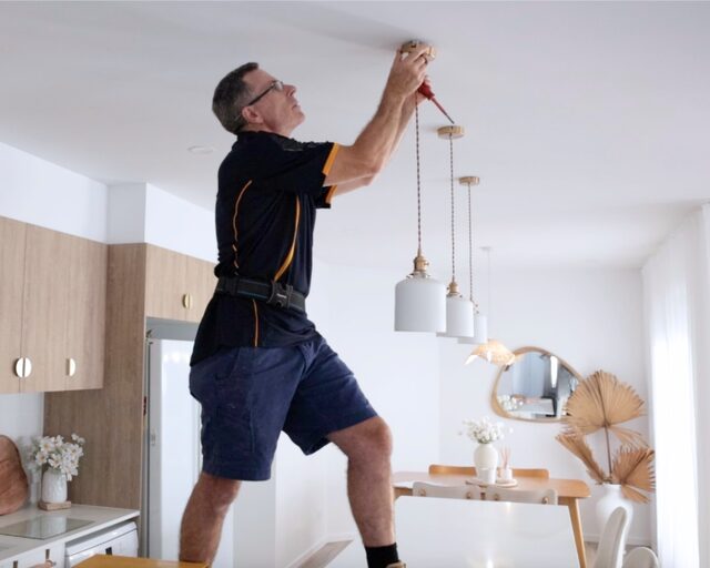 Darren hanging pendant lights over a kitchen bench