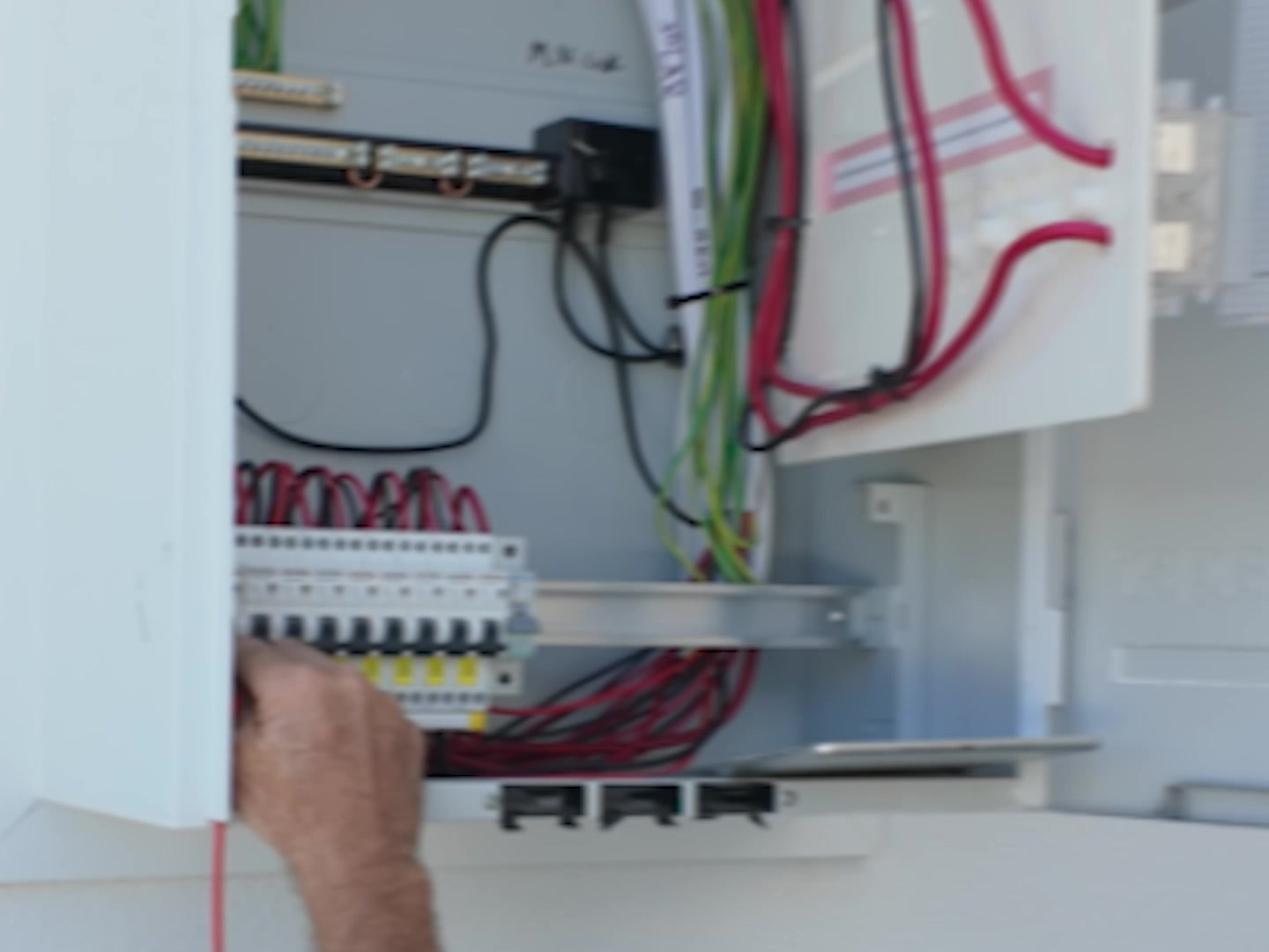 Darren testing a new safety switch board with the cover off